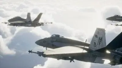 Fighter aircraft flying in formation above clouds