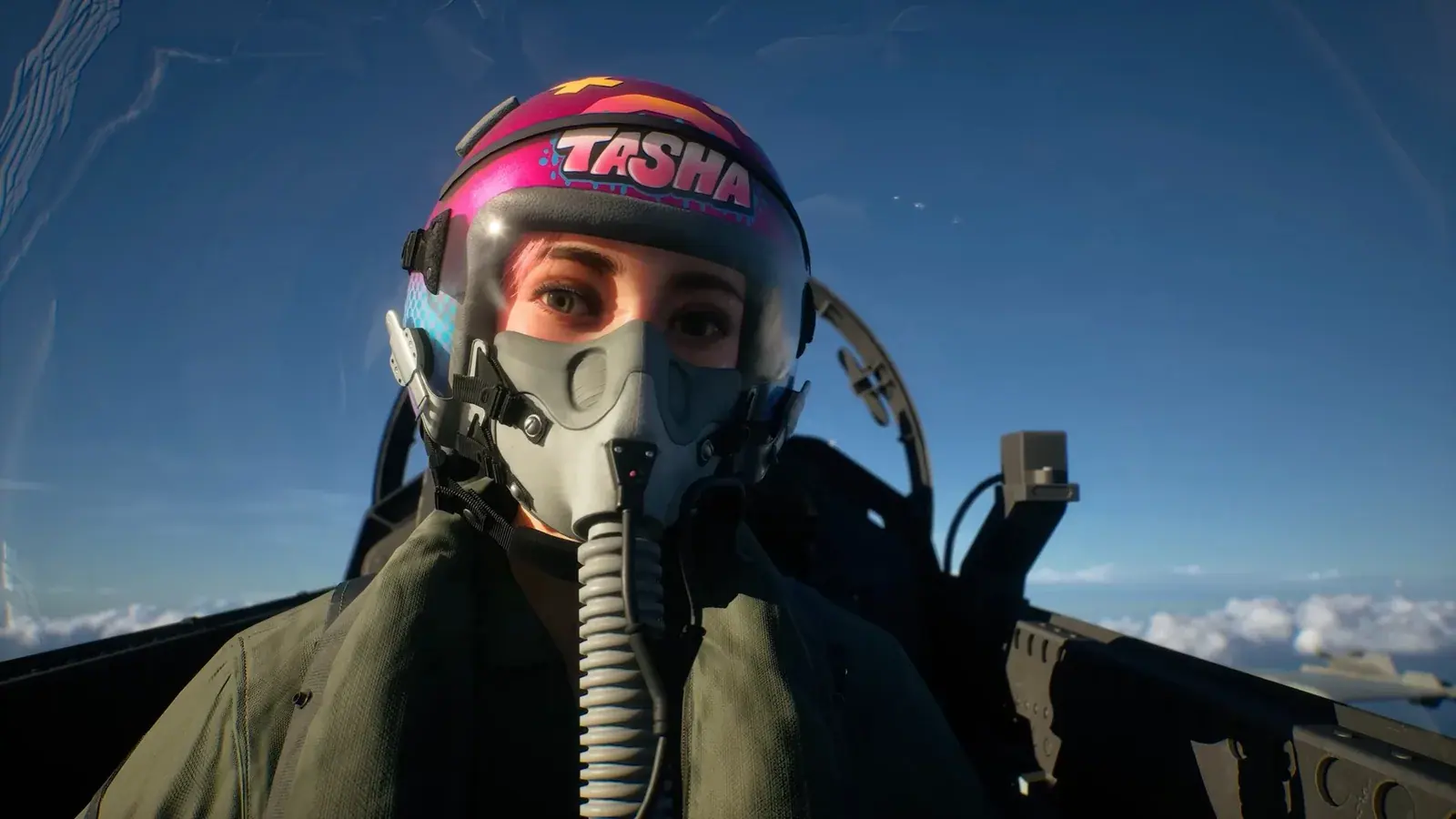 Tasha wearing her pink flight helmet inside a cockpit